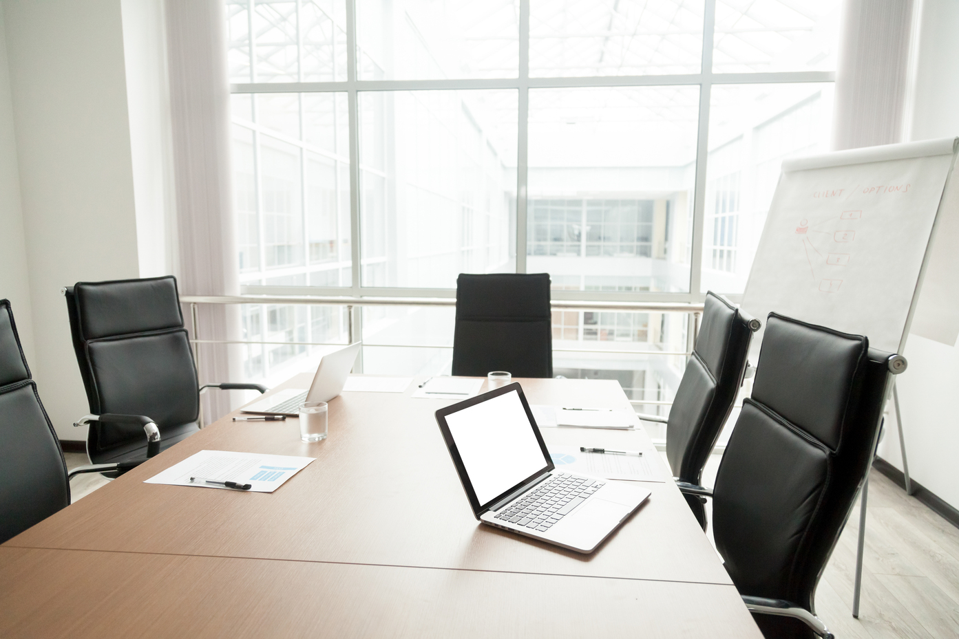 Modern office boardroom interior with conference table and big w