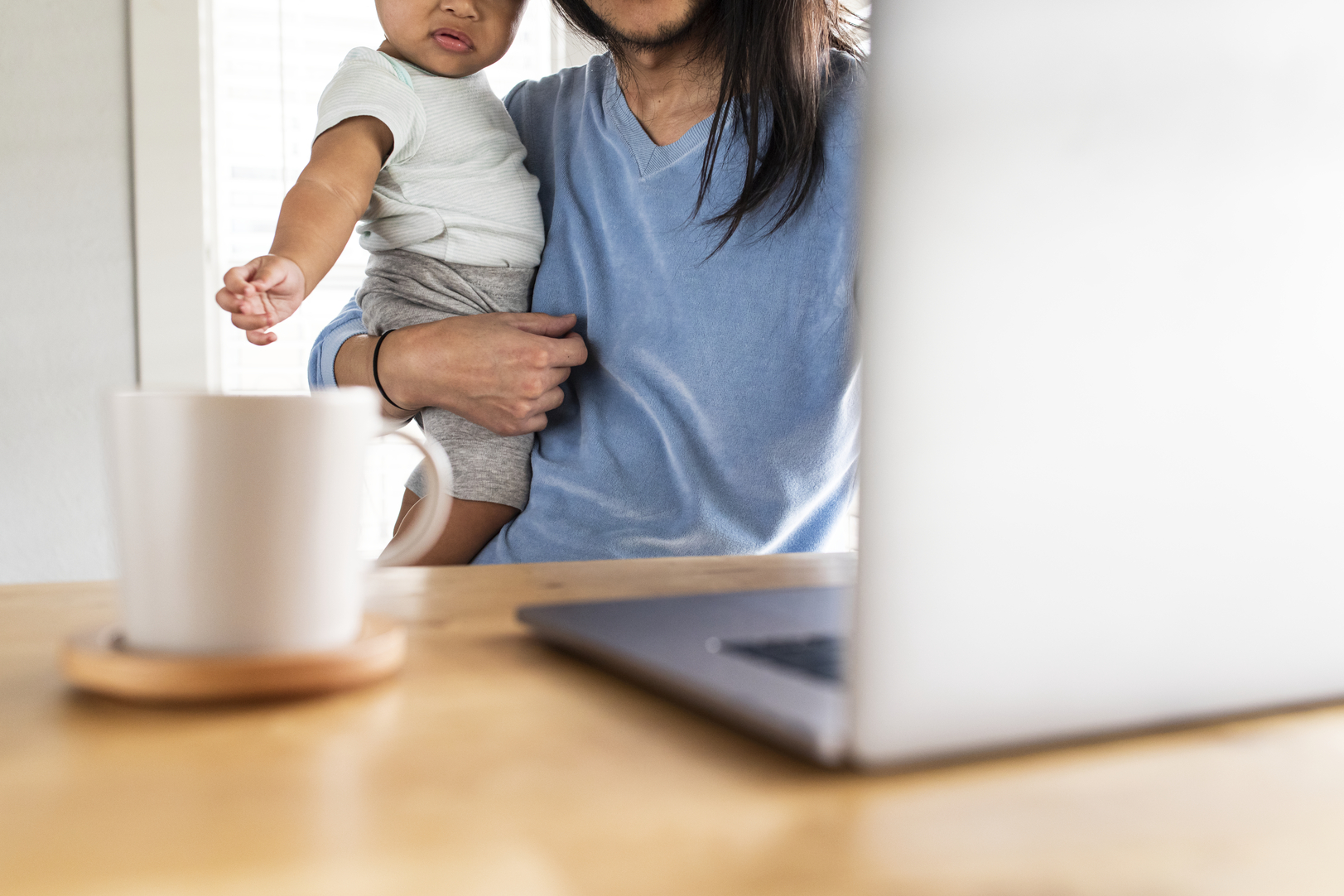 Father working from home with kid